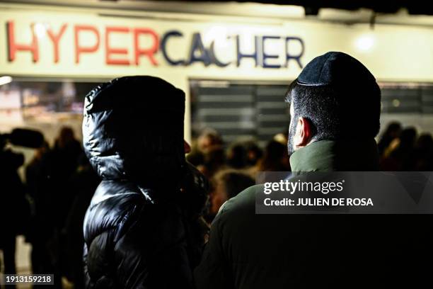 People attend a commemorative ceremony to pay tribute to the victims on the ninth anniversary of the 2015 deadly jihadist terror attack on the Hyper...