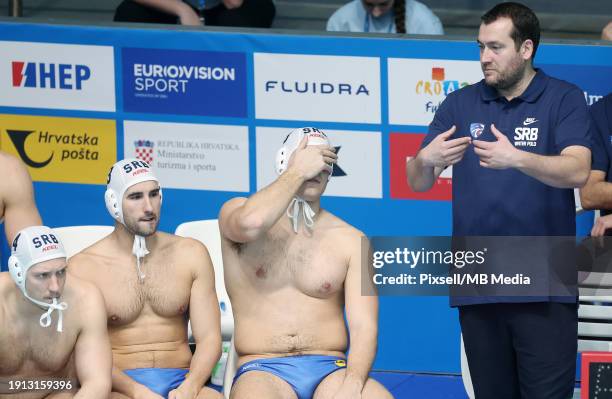 Head Coach of Serbia Uros Stevanovic talks to players during the Men's European Water Polo Championship Preliminary Round Group C match between...