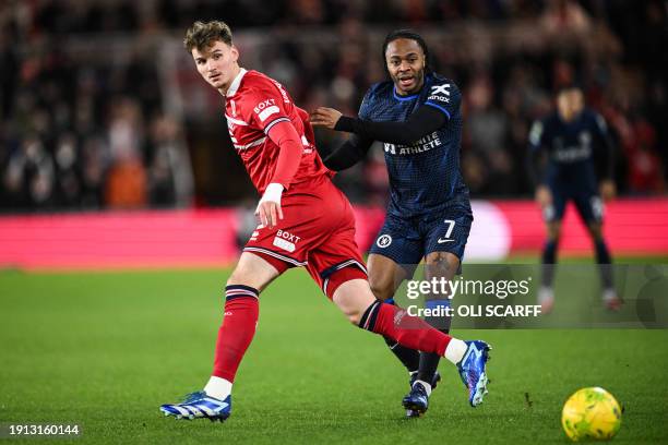 Middlesbrough's Dutch defender Rav van den Berg fights for the ball with Chelsea's English midfielder Raheem Sterling during the English League Cup...