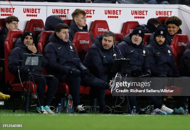 Jesus Perez, Assistant Head Coach of Chelsea and Mauricio Pochettino, Manager of Chelsea on team bench during the Carabao Cup Semi Final First Leg...