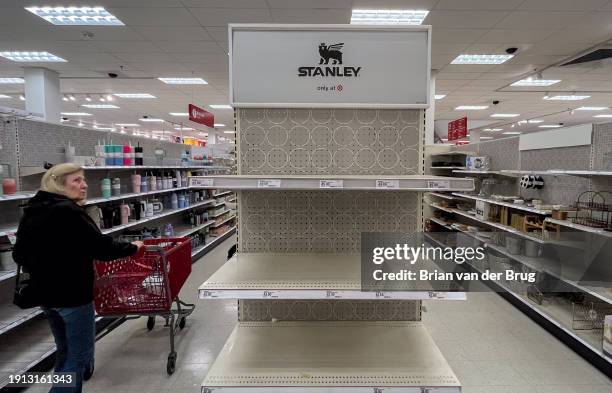 Canoga Park, CA A shopper looks over empty shelves once stocked with Stanley insulated steel tumblers at a Target store on Tuesday, Jan. 9, 2024 in...