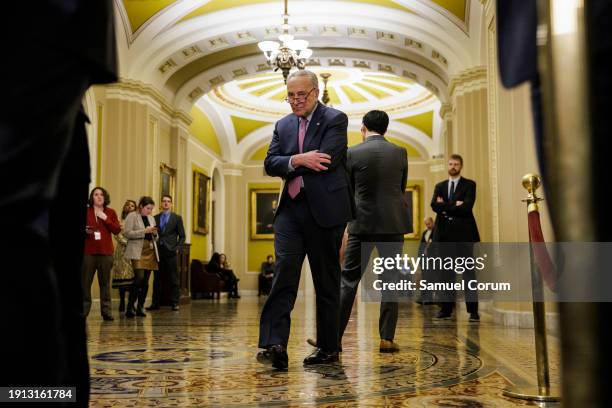 Senate Majority Leader Chuck Schumer walks back toward the podium after speaking with staff during a press conference following the Senate Republican...