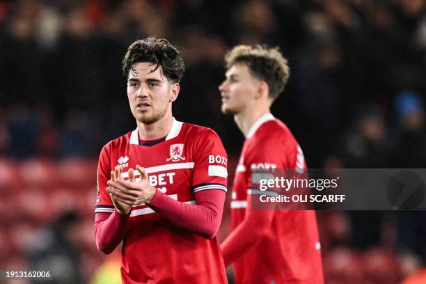 Middlesbrough's English midfielder Hayden Hackney applauds at the end of the English League Cup first-leg semi-final football match between...