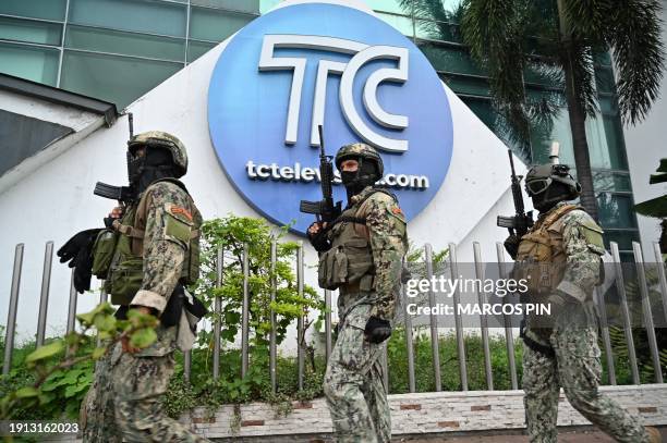 Ecuadorean soldiers patrol outside the premises of Ecuador's TC television channel after unidentified gunmen burst into the state-owned television...