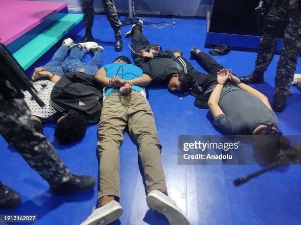 General view of suspects handcuffed with plastic handcuffs by the Ecuador forces as Ecuador president declares 'internal armed conflict,' orders...