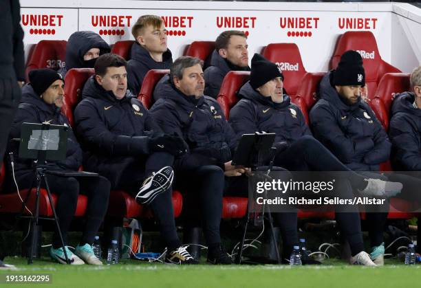 Jesus Perez, Assistant Head Coach of Chelsea and Mauricio Pochettino, Manager of Chelsea on team bench during the Carabao Cup Semi Final First Leg...