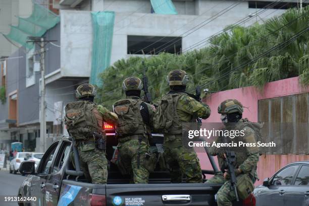 Military officers patrol a street on January 9, 2024 in Guayaquil, Ecuador. A group of armed and hooded men broke into TC Guayaquil during a live...