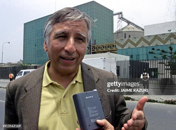 Manuel Baquedano, representative of the Ecological Political Institute of Chile, speaks with reporters in front of the Chilean pasta factory...