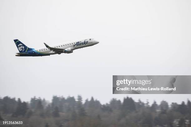 An Alaska Airlines Embraer aircraft is seen taking off at Portland International Airport on January 9, 2024 in Portland, Oregon. NTSB investigators...