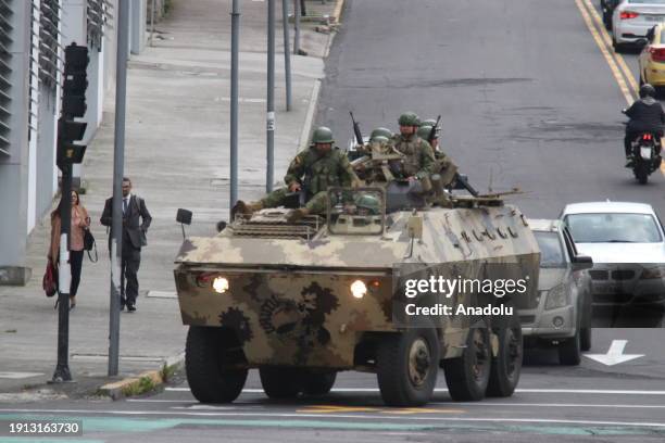 Ecuadorian soldiers take security measures with a military armored vehicle on roads after Ecuador president declares 'internal armed conflict,'...