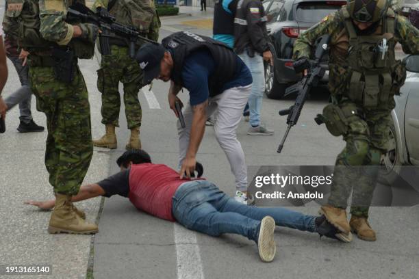 Ecuadorian police arrest several armed men who broke into the set of a public television channel after Ecuador president declares 'internal armed...
