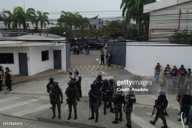 Police and soldiers take security measures as Ecuadorian police arrest several armed men who broke into the set of a public television channel after...