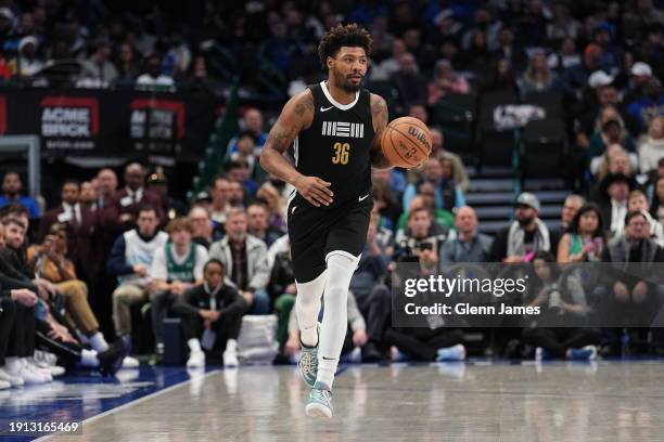 Marcus Smart of the Memphis Grizzlies dribbles the ball during the game against the Dallas Mavericks on January 9, 2024 at the American Airlines...