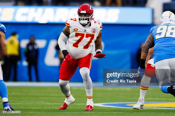 Lucas Niang of the Kansas City Chiefs blocks during a game against the Los Angeles Chargers at SoFi Stadium on January 7, 2024 in Inglewood,...