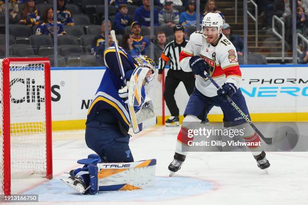 Matthew Tkachuk of the Florida Panthers attempts to deflect the puck pas Joel Hofer of the St. Louis Blues in the second period at Enterprise Center...