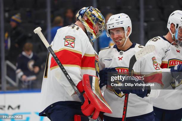 Anthony Stolarz of the Florida Panthers is congratulated by Evan Rodrigues of the Florida Panthers after beating the St. Louis Blues in the third...