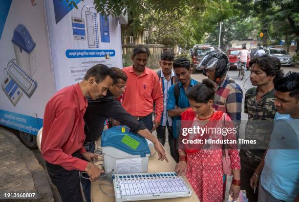 Officials on behalf of the Election Commission brief the people about the use and functions of EVM machines as part of awareness program for upcoming...