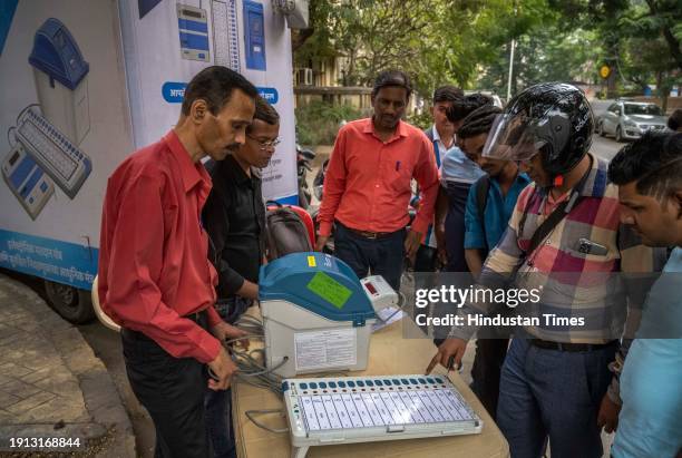 Officials on behalf of the Election Commission brief the people about the use and functions of EVM machines as part of awareness program for upcoming...