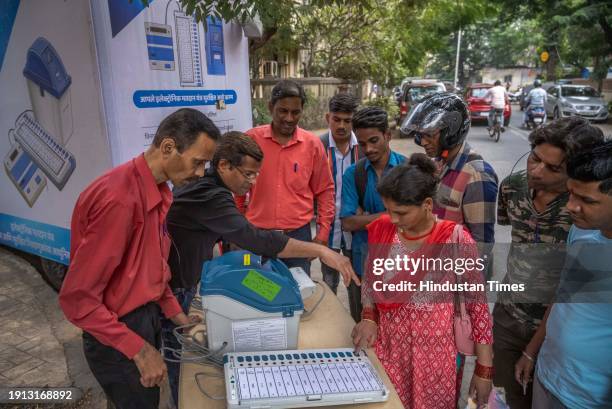 Officials on behalf of the Election Commission brief the people about the use and functions of EVM machines as part of awareness program for upcoming...