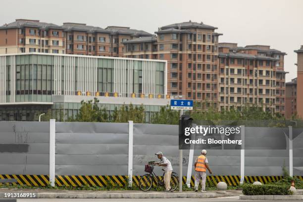 Pedestrians in the commercial and residential district, in Xiongan, China, on Monday, Aug. 21, 2023. China has spent more than double the cost of the...