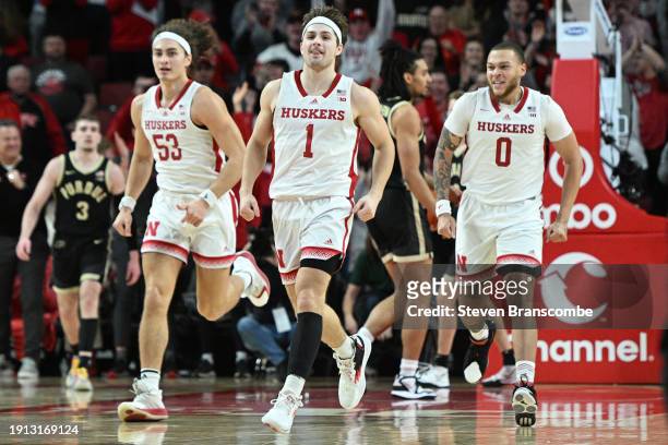Sam Hoiberg of the Nebraska Cornhuskers races down the court with Josiah Allick and C.J. Wilcher after scoring against the Purdue Boilermakers in the...
