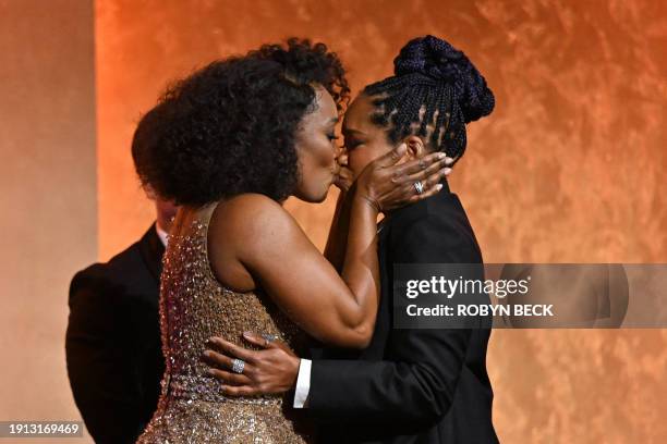 Actress and Honorary Award recipient Angela Bassett kisses US actress Regina King during the Academy of Motion Picture Arts and Sciences' 14th Annual...