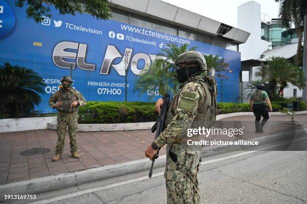 Dpatop - 09 January 2024, Ecuador, Guayaquil: Soldiers surround the TC television station building after gunmen broke into the station's premises...