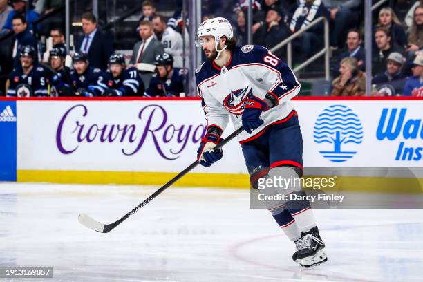Kirill Marchenko of the Columbus Blue Jackets follows the play up the ice during second period action against the Winnipeg Jets at the Canada Life...