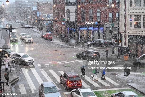 Pedestrian and motorist are seen from the CTA Damen Blue Line station at the intersection of Damen Avenue, North Avenue and Milwaukee Avenue as it...