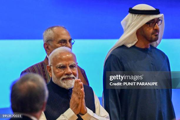 Indian Prime Minister Narendra Modi arrives with President of the United Arab Emirates Sheikh Mohamed bin Zayed Al Nahyan for the inaugural session...