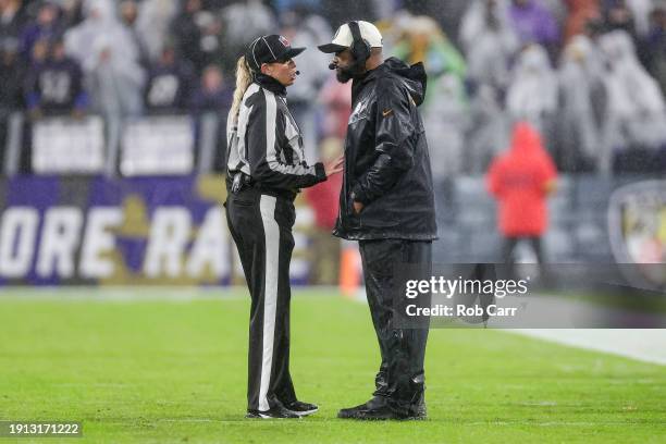 Head coach Mike Tomlin of the Pittsburgh Steelers talks with down judge Sarah Thomas in the second quarter of a game against the Baltimore Ravens at...