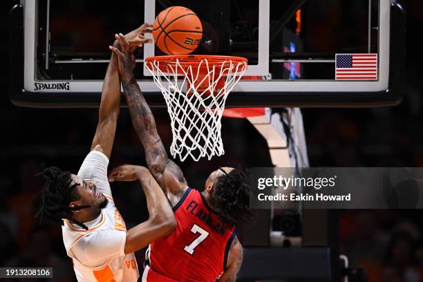 Jonas Aidoo of the Tennessee Volunteers gets fouled by Allen Flanigan of the Ole Miss Rebels in the first half at Thompson-Boling Arena on January...