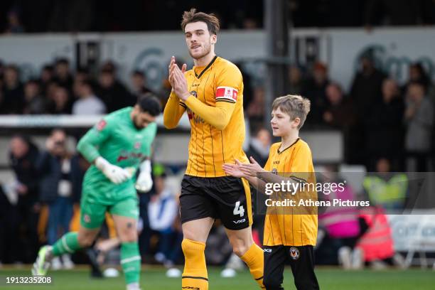 Ryan Delaney of Newport County applauds the supporters during the Emirates FA Cup Third Round match between Newport County and Eastleigh at Rodney...