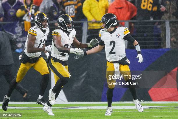Mason Rudolph of the Pittsburgh Steelers and Najee Harris celebrate after a touchdown in the fourth quarter of a game against the Baltimore Ravensat...