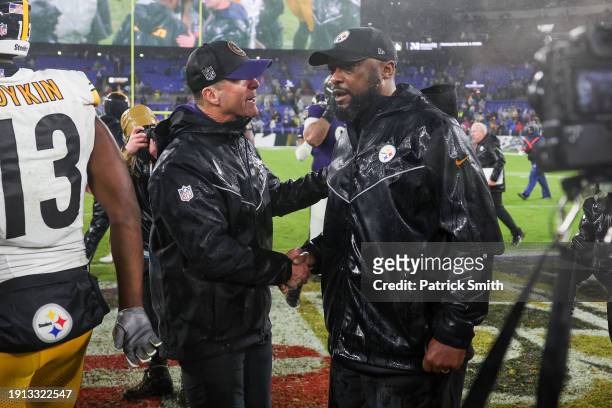 Head coach Mike Tomlin of the Pittsburgh Steelers and Head coach John Harbaugh of the Baltimore Ravens shake hands after the Steelers defeated the...