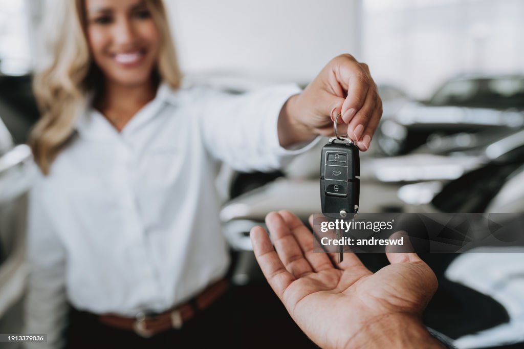 Handing over car keys buying a car