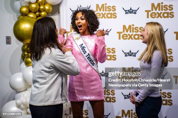 Miss Texas 2023, Ellie Breux, reacts as she chats with former high school dance teachers, Miranda Richter and Emily Wendt at the Missouri City...