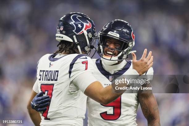 Stroud an Brevin Jordan of the Houston Texans celebrate a touchdown during the first quarter against the Indianapolis Colts at Lucas Oil Stadium on...