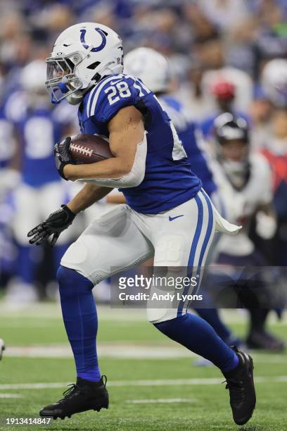 Jonathan Taylor of the Indianapolis Colts runs with the ball during the first quarter against the Houston Texans at Lucas Oil Stadium on January 06,...