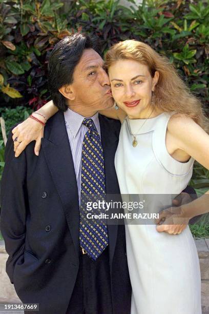 Peruvian presidential candidate Alexander Toledo of the opposition party known as Peru Possible kisses his wife, Eliane Karp 21 March 2000 in the...