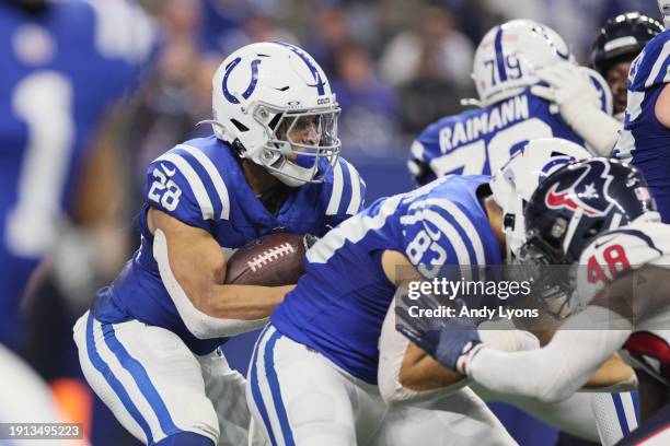 Jonathan Taylor of the Indianapolis Colts runs with the ball during the second quarter against the Houston Texans at Lucas Oil Stadium on January 06,...