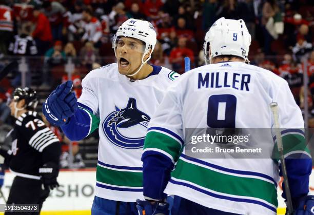 Dakota Joshua of the Vancouver Canucks scores an empty net goal against the New Jersey Devils at 18:41 of the third period at Prudential Center on...