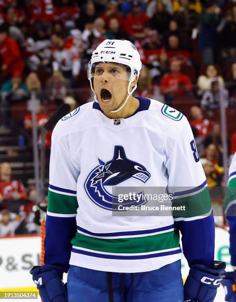 Dakota Joshua of the Vancouver Canucks scores an empty net goal against the New Jersey Devils at 18:41 of the third period at Prudential Center on...