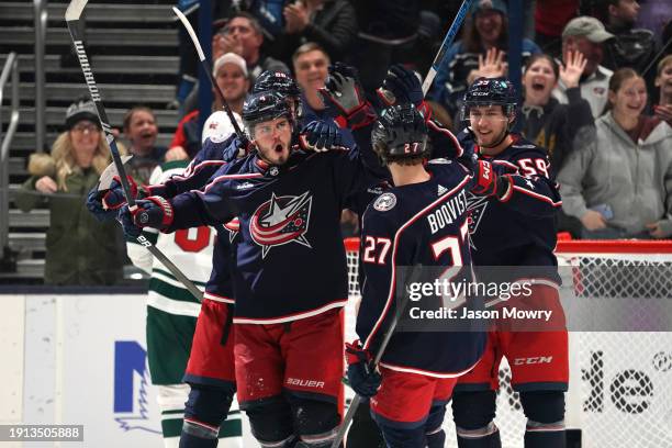 Cole Sillinger of the Columbus Blue Jackets celebrates a hat trick with his team mates during the third period against the Minnesota Wild at...