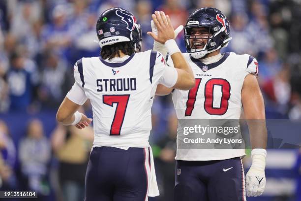 Stroud and Juice Scruggs of the Houston Texans celebrate a touchdown pass during the second quarter against the Indianapolis Colts at Lucas Oil...