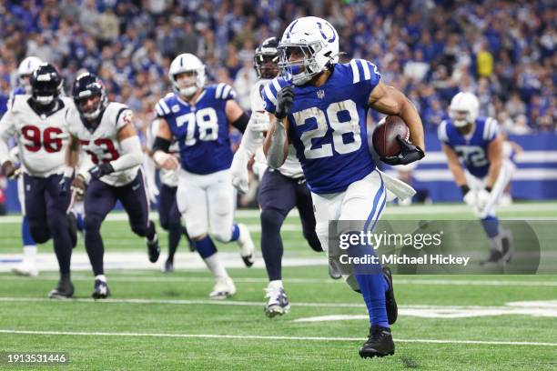 Jonathan Taylor of the Indianapolis Colts runs with the ball during the third quarter against the Houston Texans at Lucas Oil Stadium on January 06,...