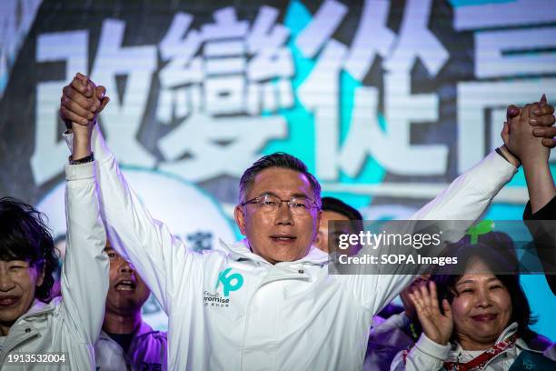 Ko Wen-je, Taiwan People's Party presidential candidate holds hands with his comrades during a campaign rally in Kaohsiung. In the final week before...