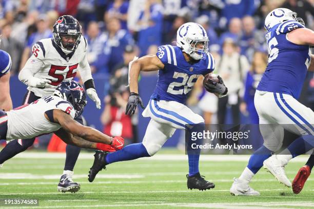 Jonathan Taylor of the Indianapolis Colts runs with the ball during the third quarter against the Houston Texans at Lucas Oil Stadium on January 06,...