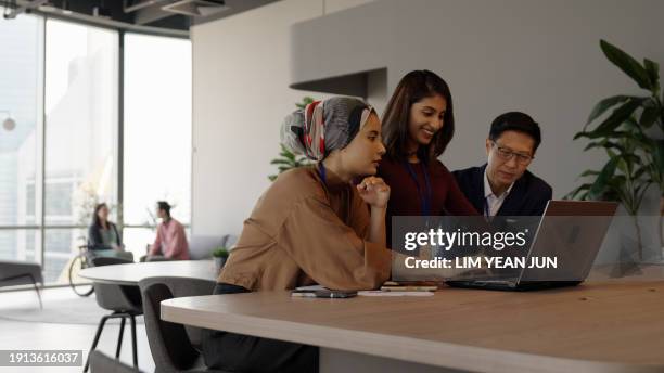 engagement between a diverse and inclusive asian business team - colleague engagement stock pictures, royalty-free photos & images