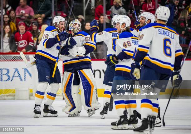 The St. Louis Blues celebrate after a shootout victory against the Carolina Hurricanes at PNC Arena on January 06, 2024 in Raleigh, North Carolina.